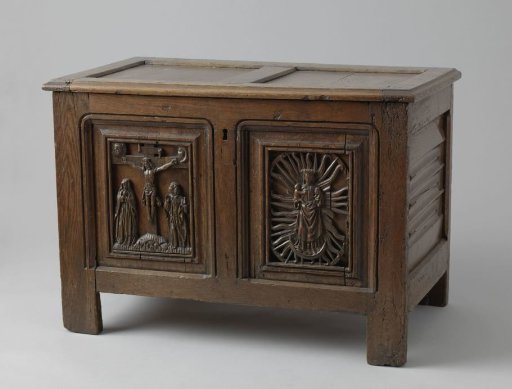 Sacristy chest with carved decoration depicting Christ on the Cross and the Madonna on the crescent moon