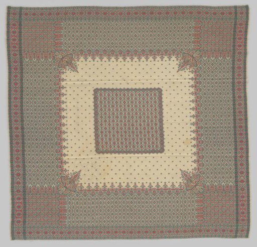 Nearly square wool scarf with a cream ground featuring stylized cross and star motifs woven in red and grey-blue