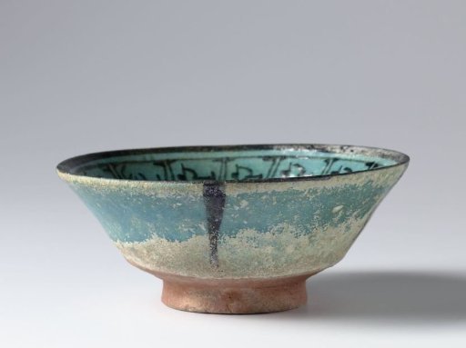 Bowl with a stylized plant and a border with a pseudo-inscription