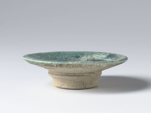 Shallow bowl on foot with a turquoise glaze