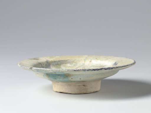 Shallow bowl with an iridescent turquoise glaze