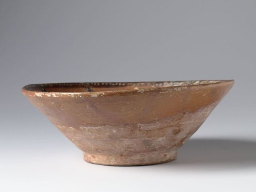 Bowl with nine petal motifs in panels
