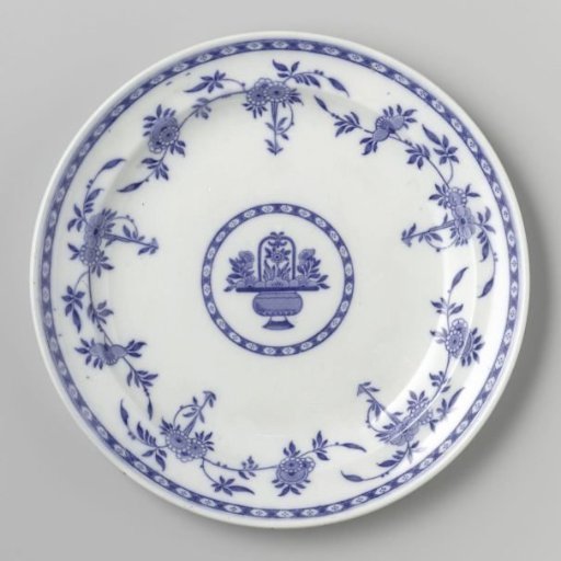 Plate with a sculpted rim, decorated in blue with flowers. On the flat surface a vase with handles and flowers.