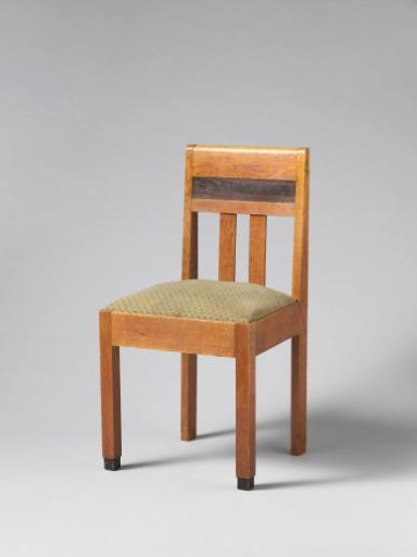 Chair with a black rule on the backrest and upholstered in green wool