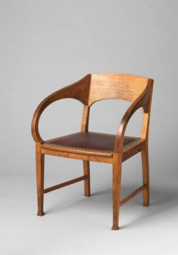 Armchair with curved armrests and leather upholstery
