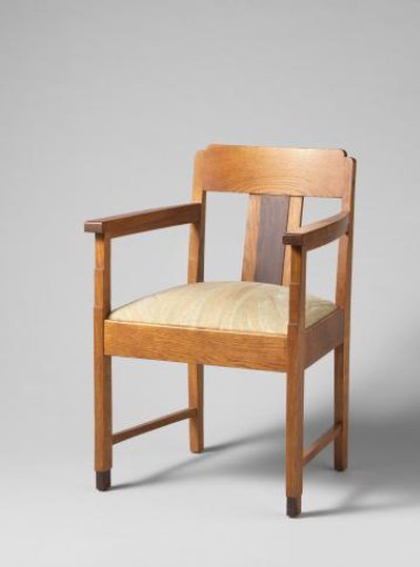 Armchair with a dark back panel