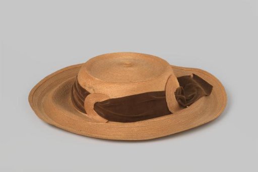 Hat of Natural Straw Band with Wide Brim and Flat Crown, Surrounded by a Wide Brown Velvet Band and Circles of Straw Band