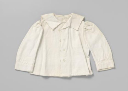 Short children's jacket of white cotton piqué
