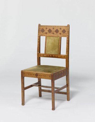 Chair of padauk wood, decorated with engraved patterns and inlaid with a tropical wood