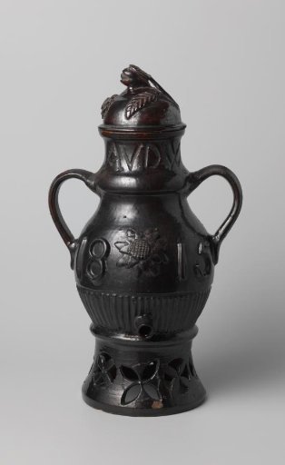 Lid of a coffee pot of dark brown glazed earthenware