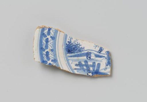 Fragment of a plate painted with a landscape with a bridge