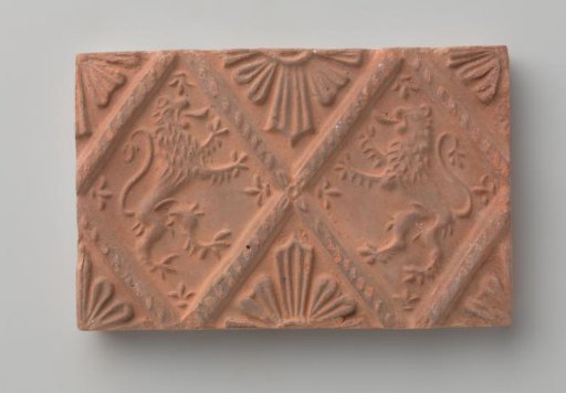 Fireplace stone with depiction of two climbing lions