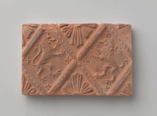 Fireplace stone with a depiction of two climbing lions