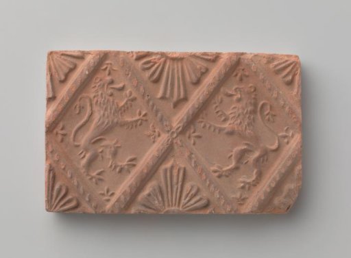 Fireplace stone with a depiction of two climbing lions