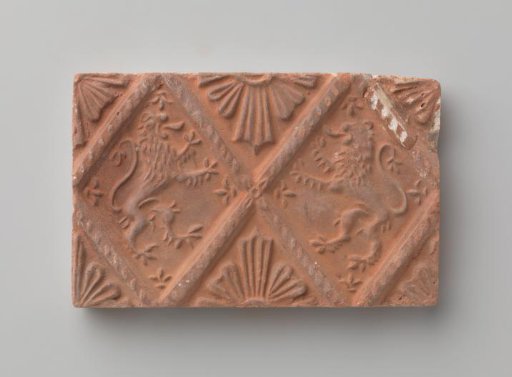 Fireplace stone with a depiction of two climbing lions