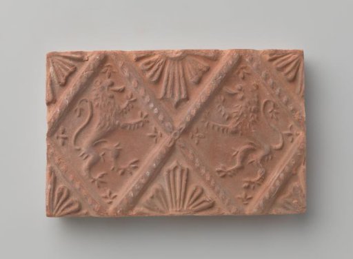 Fireplace stone with a depiction of two climbing lions