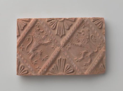 Fireplace with a Depiction of Two Climbing Lions
