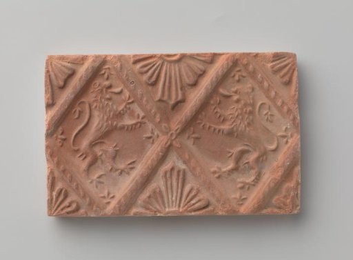 Fireplace with a depiction of two climbing lions