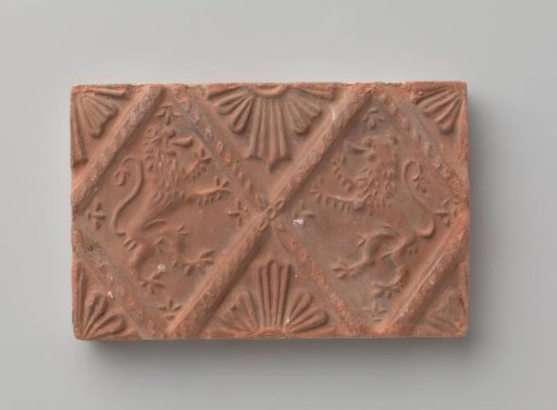 Fireplace with a depiction of two climbing lions