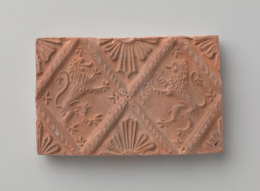 Fireplace with a depiction of two climbing lions