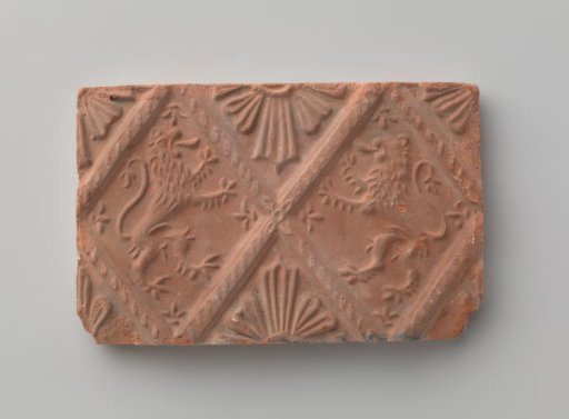 Fireplace with a depiction of two climbing lions