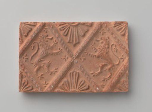 Fireplace with a depiction of two climbing lions