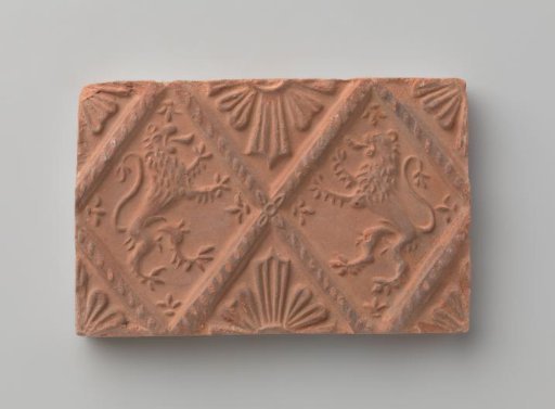 Fireplace Tile Depicting Two Climbing Lions