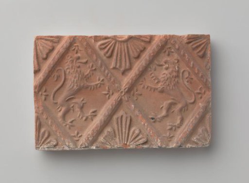 Fireplace with a depiction of two climbing lions