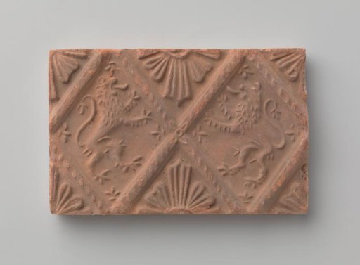Fireplace stone with depiction of two climbing lions