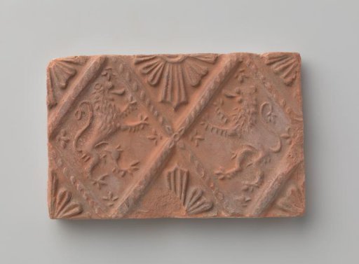 Fireplace with a depiction of two climbing lions