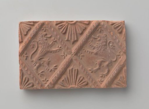 Fireplace with a depiction of two climbing lions