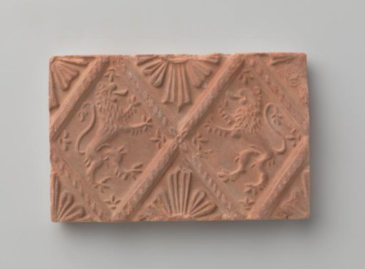 Fireplace with a depiction of two climbing lions