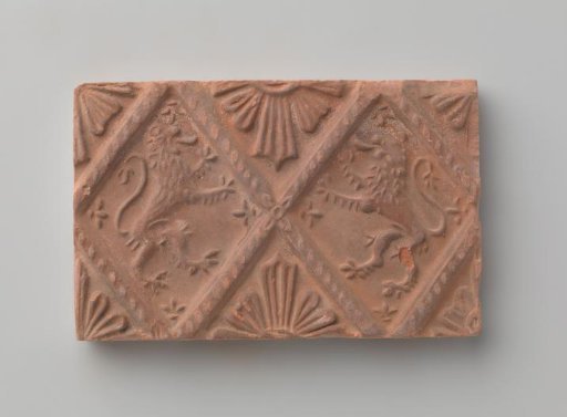 Fireplace with a depiction of two climbing lions