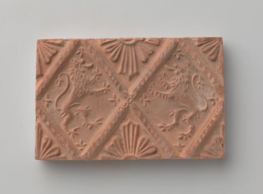 Fireplace with a depiction of two climbing lions
