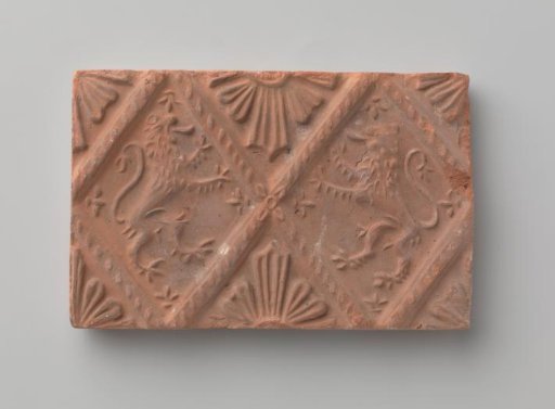Fireplace with a depiction of two climbing lions