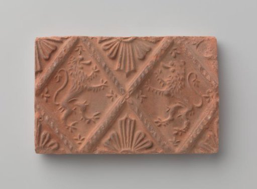 Fireplace surround depicting two climbing lions