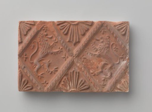 Fireplace surround depicting two climbing lions