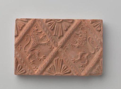 Fireplace surround depicting two climbing lions