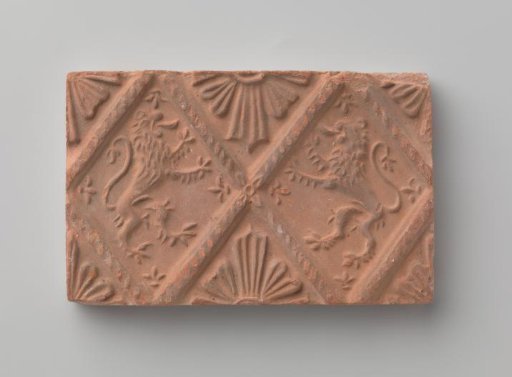 Fireplace surround depicting two climbing lions