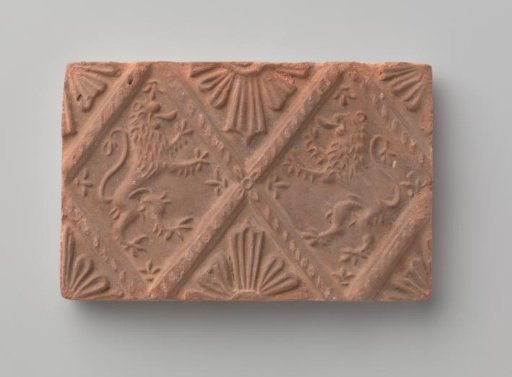 Fireplace with a depiction of two climbing lions