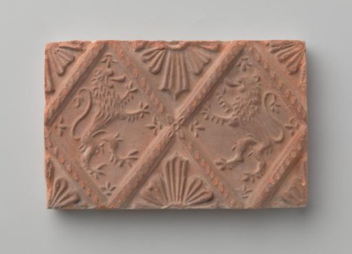 Fireplace with a depiction of two climbing lions
