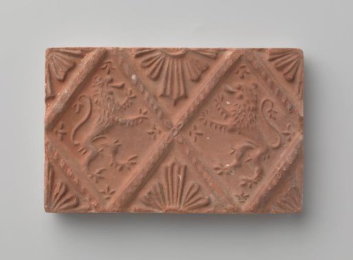 Fireplace with a depiction of two climbing lions