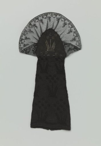 Mitten, black, knitted in a fancy pattern