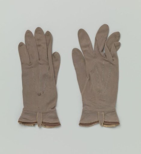 Pair of gloves with double cuffs