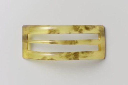Hairpin of speckled plastic, in curved rectangular shape