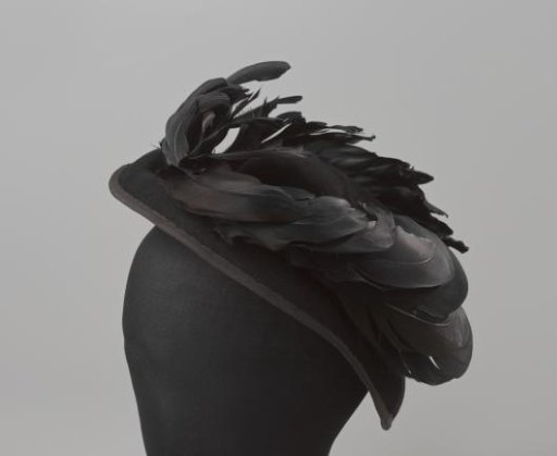 Hat of black felt with hanging brims and black feathers