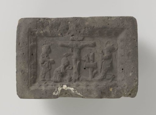 Fireplace with a depiction of Christ on the cross with the three Marys