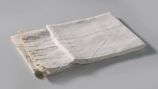 Linen cloth with a gathered pleated strip attached at the top, applied leaves and the initials BU