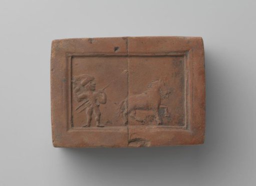 Fireplace with a representation of a man with a spear and a horse