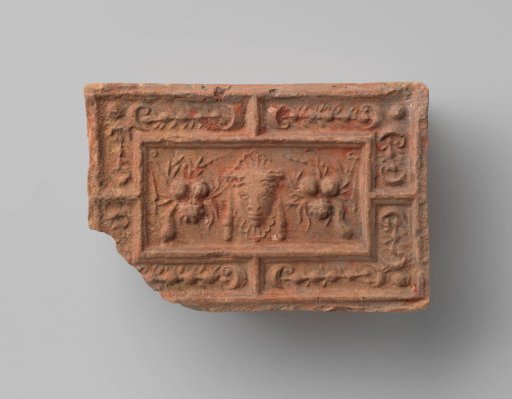 Fireplace with a Representation of a Mask Between Two Fruit Swags